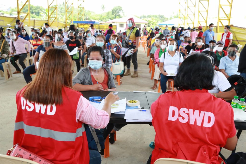 SLP beneficiaries already received P176M aid - DSWD-7. The DSWD-7 personnel distribute the Sustainable Livelihood program aid to Mandaue beneficiaries in Mandaue City  in February 2022. | Contributed photo