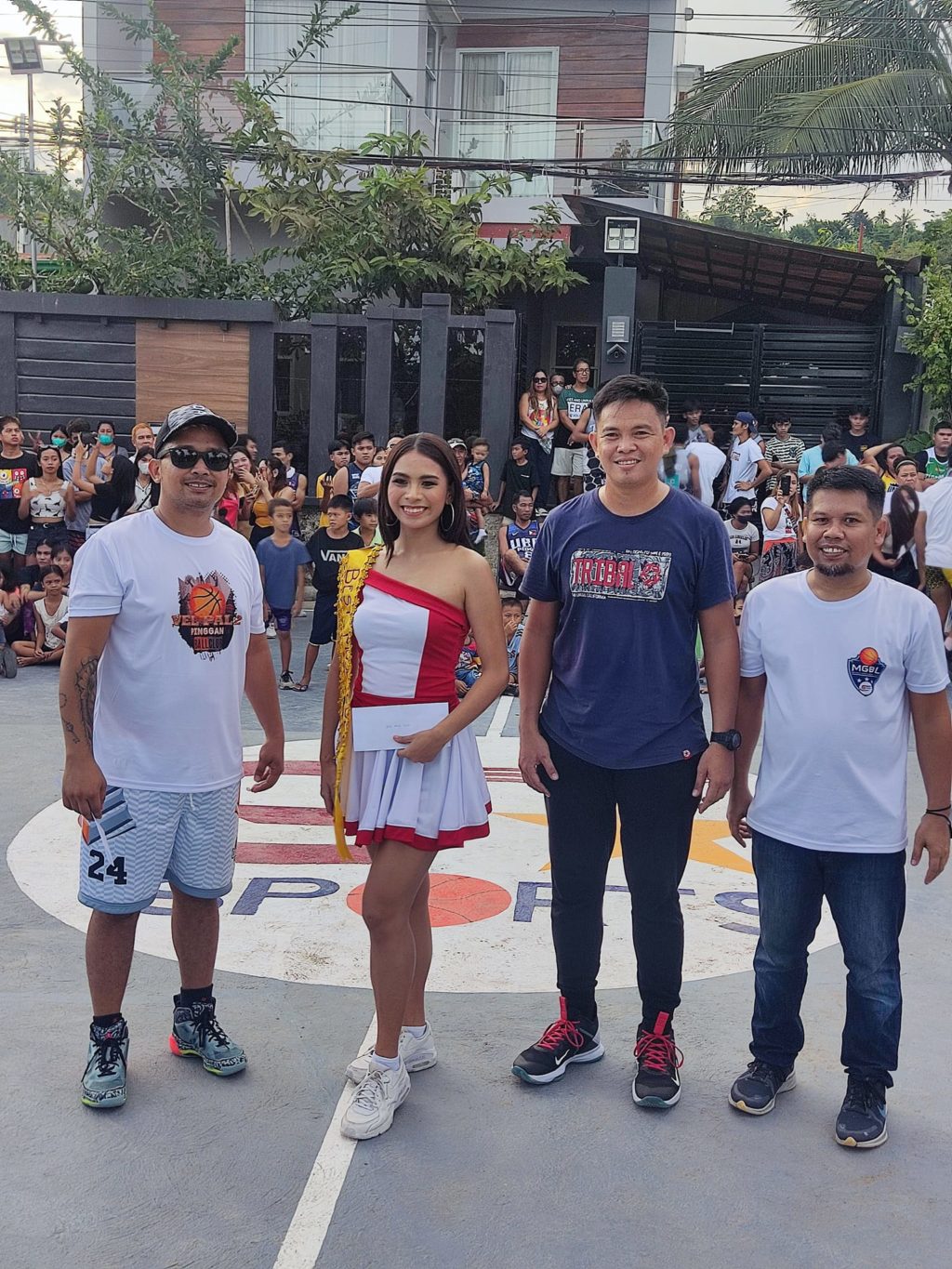 Gerry Canonigo (left) joins the winning muse and fellow organizers of the V2Pi Basketball League during last Sunday's opening ceremony at the Vel Pal 2 Pinggan open court in Barangay Pakigne, Minglanilla town. | Contributed Photo