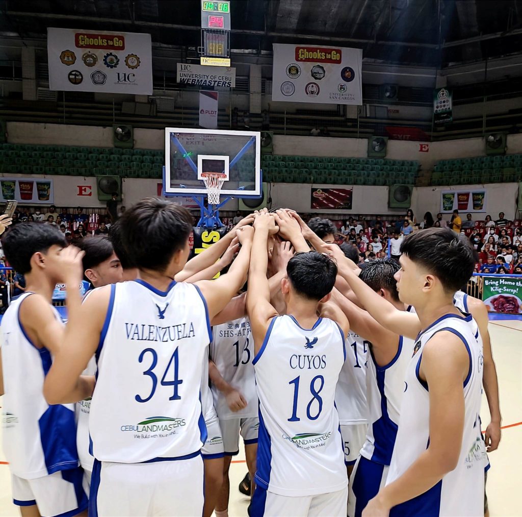 Magis Eagles high school team outlasts CEC Dragons, gets win No. 2 in Sunday’s Cesafi game. The SHS-AdC players huddle up in the middle of the court after their win in the Cesafi high school division versus CEC Dragons. | Glendale Rosal