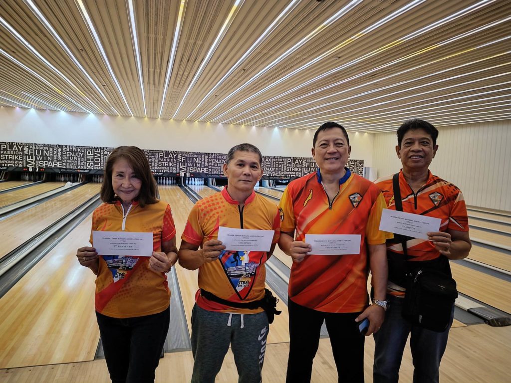 Dina Calipay (from left), Roger Asumbrado, Marvin Sevilla, and Florante Calipay Sr. show their prizes for winning the STBAI tournament. | Contributed photo