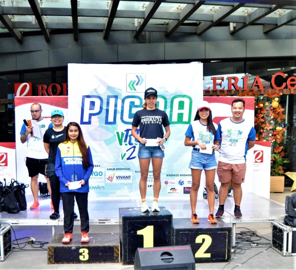 Ruffa Sorongon (top of the podium), who finished first in the 16K female category, receive her prize together with the other female winners in the PICPA Run V2.0 | Photo from John Velez