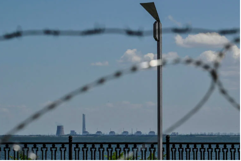 Zaporizhzhia Nuclear Power Plant is seen from an embankment of the Dnipro river in the town of Nikopol, as Russia’s attack on Ukraine continues, in Dnipropetrovsk region, Ukraine July 20, 2022. (REUTERS)