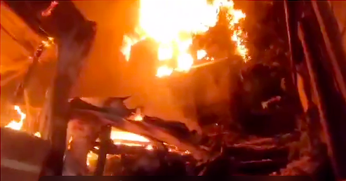 Fire rages at the height of the fire that hit Sitio Langub, Barangay Kalunasan, Cebu City at past 10 p.m. on Nov. 5, where 50 houses were destroyed and 205 people were displaced. | Screenshot of contributed video via Paul Lauro