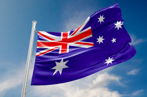 FILE PHOTO: Australian flag is waving at a beautiful and peaceful sky in day time while sun is shining.