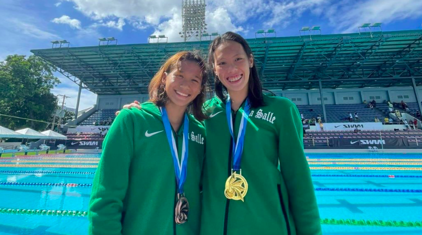 Raven Faith Alcoseba (left) poses with her teammate Xiandi Chua (right) during the UAAP swimming competition in Manila. | Photo from Fritz Alcoseba