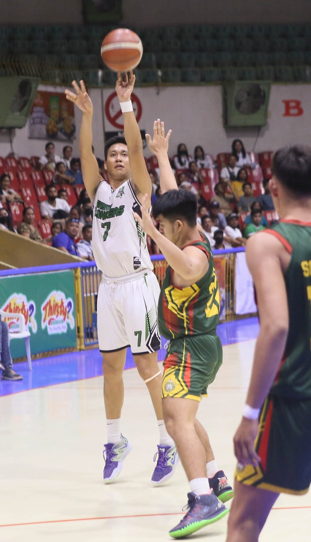UV Green Lancers' team captain Ted Saga attempts a three-point shot during their game against USJ-R in the Cesafi men's basketball tournament. Saga leads the cast of the three-point shootout in the Cesafi All-Star Games tomorrow. | Photo from Sugbuanong Kodaker