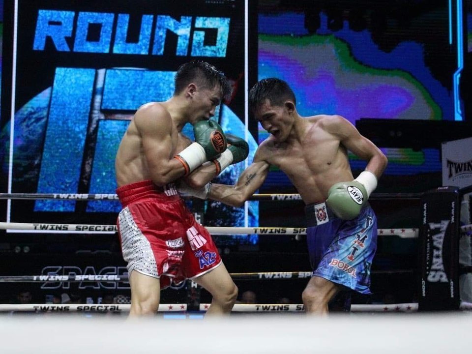 Jake Amparo connects a body shot against Huu-Toan Le during their WBA Asia minimumweight title showdown in Bangkok, Thailand on Wednesday, Nov. 30, 2022. | Photo from the WBA ASIA - WBA Asia Boxing Association Facebook page