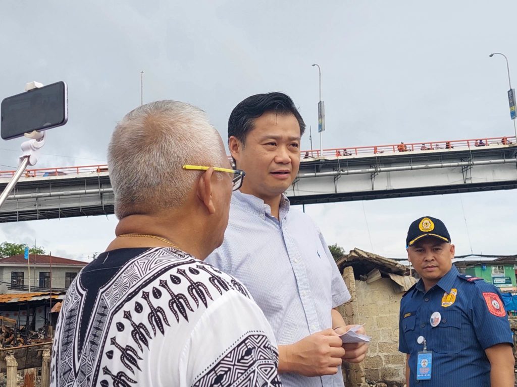 Senator Sherwin Gatchalian visits the site of the Nov. 30 fire that hit Sitio Paradise in Barangay Looc, Mandaue City. | Futch Anthony Inso