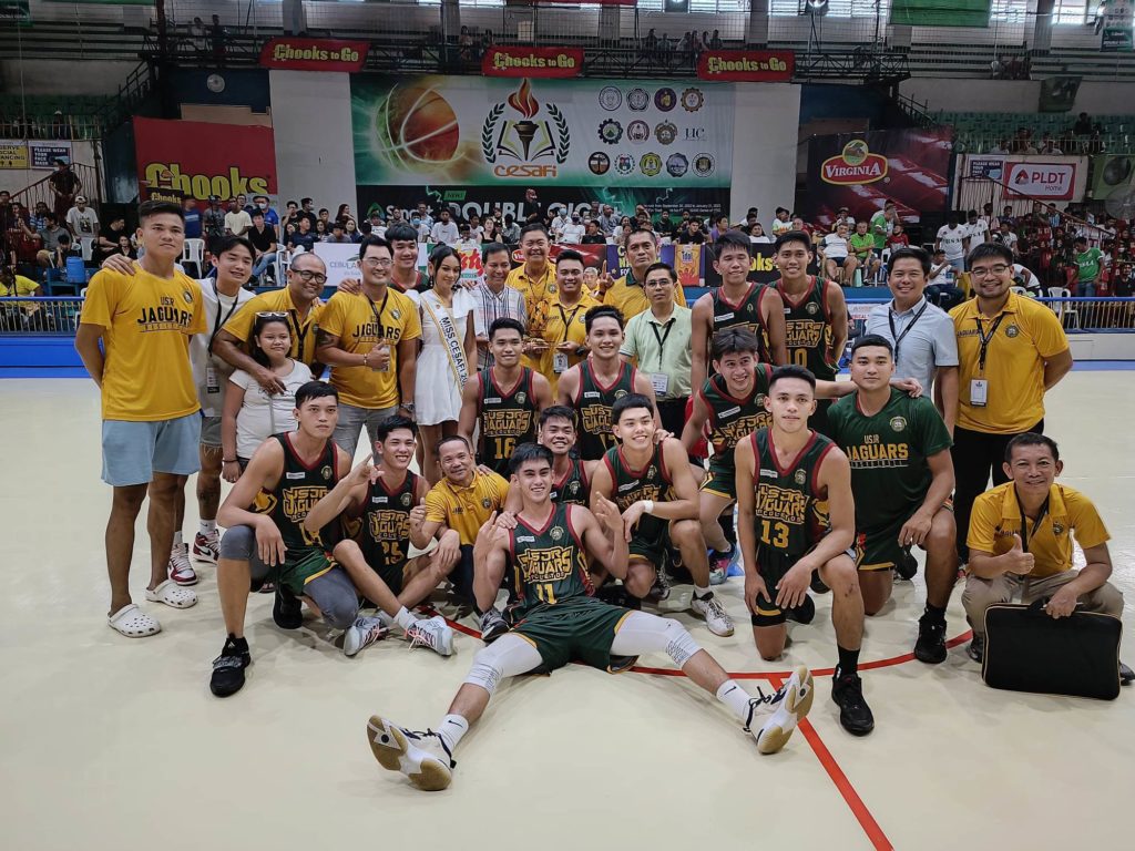 The USJ-R Jaguars' men's basketball team poses for a group shot as they celebrate their third place finish in the Cesafi men's basketball tournament on Sunday, Dec. 11, 2022, at the Cebu Coliseum. | Glendale Rosal