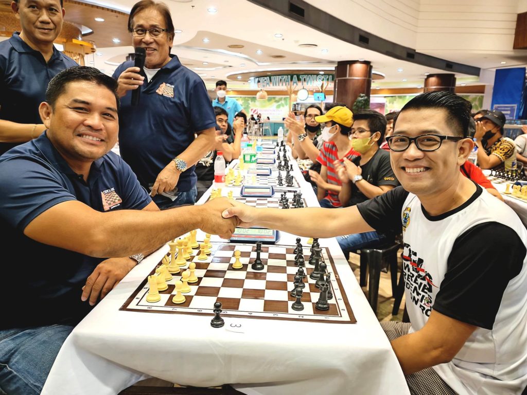 Cepca President Engineer Jerry Maratas (left) and Closap Executive Director Gary Lao make the ceremonial move of the CEPCA-CLOSAP Make a Move Against Drugs Open Chess Tournament at the Robinsons Galleria Cebu on Sunday, Dec. 11, 2022. | Glendale Rosal