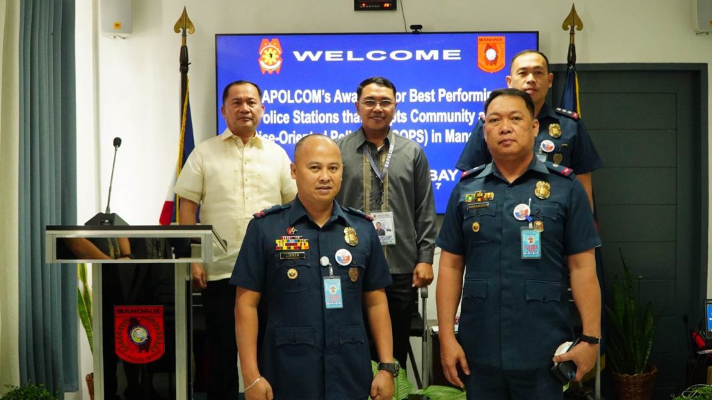 The police chiefs of the Opao and Centro Police Stations of the Mandaue City Police Office are there at the awarding ceremony where an official of the Napolcom-7 recognized these two police stations for adopting the community and service oriented policing system or CSOPS. | Mandaue City Police Office
