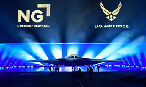 The B-21 Raider is unveiled during a ceremony at Northrop Grumman’s Air Force Plant 42 in Palmdale, California, December 2, 2022. – The high-tech stealth bomber can carry nuclear and conventional weapons and is designed to be able to fly without a crew on board.  (Photo by Frederic J. BROWN / AFP)