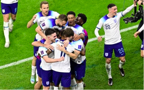 FILE–England’s forward #11 Marcus Rashford (C front) celebrates with teammates after scoring his team’s first goal during the Qatar 2022 World Cup Group B football match. (Photo by JAVIER SORIANO / AFP)