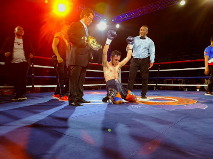 Daniel Nicolas drops to his knees after being announced the winner of the WBO Oriental Youth featherweight title against Jestine Tesoro. | Glendale Rosal