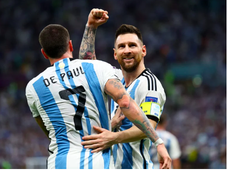 Argentina’s Lionel Messi and Rodrigo De Paul celebrate after Nahuel Molina scores their first goal against the Netherlands in the  FIFA World Cup Qatar 2022 Quarterfinals at the Lusail Stadium, Lusail, Qatar on December 9, 2022 (REUTERS)