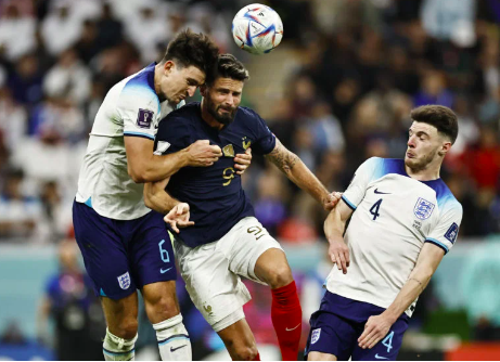 England’s Harry Maguire in action with France’s Olivier Giroud in the quarterfinals of the FIFA World Cup Qatar 2022 at the Al Bayt Stadium in Al Khor, Qatar on December 10, 2022 (REUTERS)