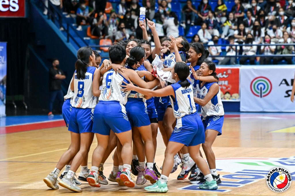 The Abellana National School (ANS) girls basketball team erupts in celebration after beating Region 10's Cagayan de Oro in the BPBL grand finals' championship game on Sunday at the San Juan gymnasium in Metro Manila.