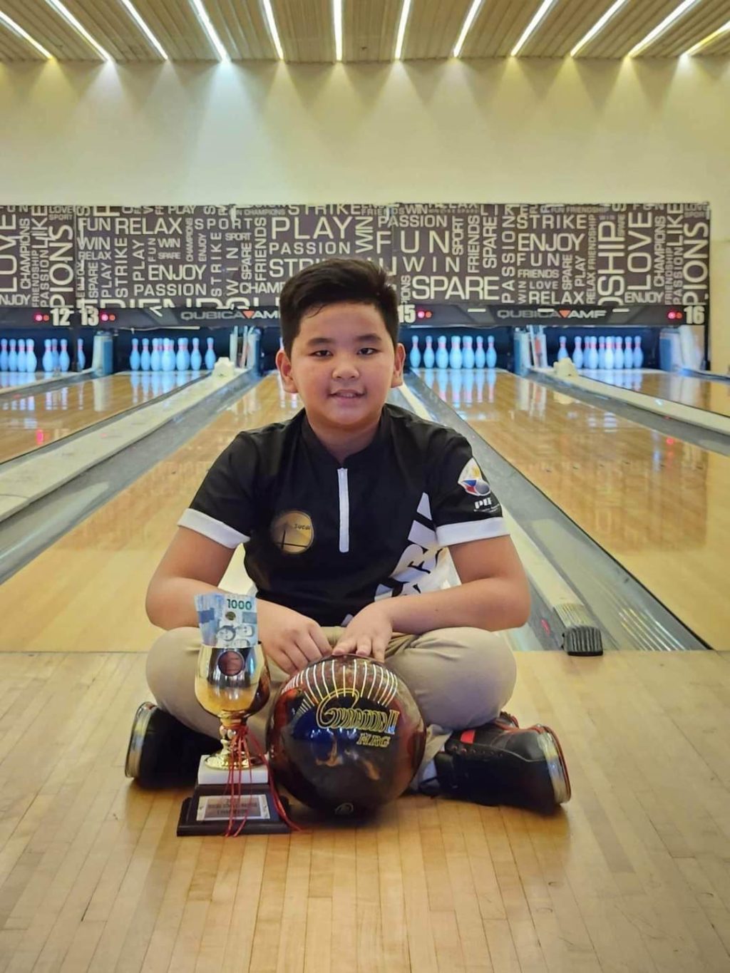 Twelve-year-old Michael John Villa, who beat adult bowlers in the Sugbu Singles Classic, an open bowling tournament, is seen as the ‘next bowling prodigy’ of the Sugbu Youth Program. | Contributed photo 