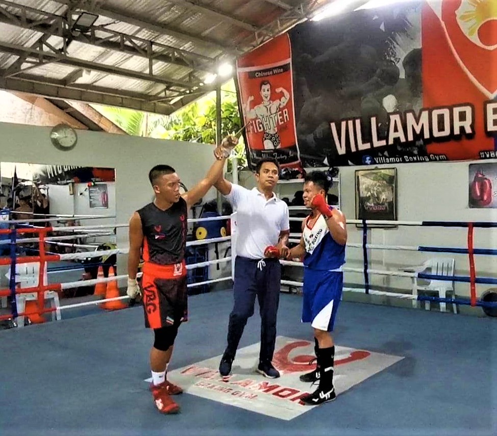PMI Bohol, Riverside Mandaue pugs log 2 wins in Villamor Boxing Gym's grassroots program. In photo is Vicente Unidos raising his hands after winning against Jemuel Aranas during their 54kg division bout in the monthly amateur boxing event of the Villamor Boxing Gym last Saturday, Jan. 21, 2023. | Contributed Photo
