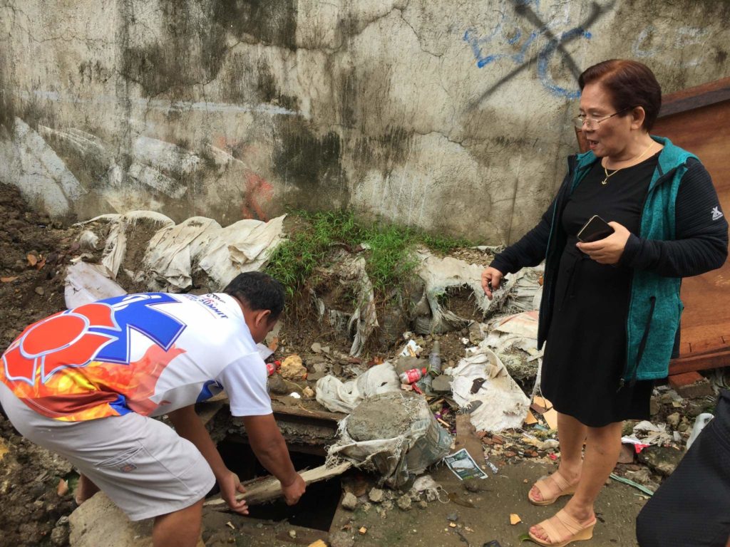 Casuntingan Barangay Captain Amelia Basiga Ale on Thursday, Jan. 26, show one of the barangays manholes whose cover was stolen. | Contributed photo