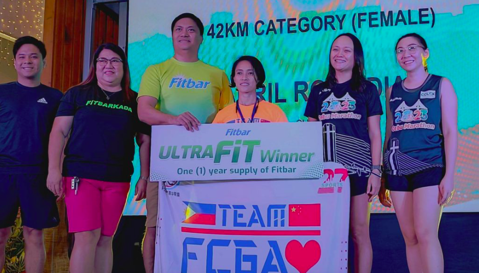April Rose Diaz (in orange shirt) poses with the sponsors of the Cebu City Marathon 2023 during the awarding ceremony at the SM Seaside City Cebu. | Glendale Rosal