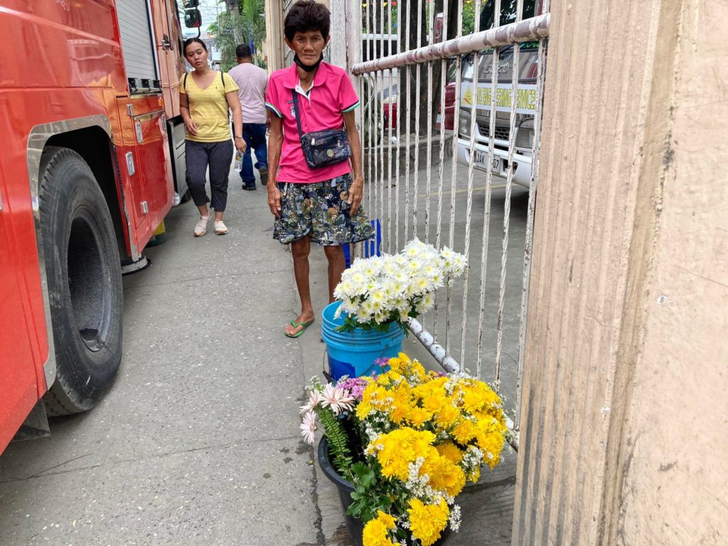 Love and flowers: A peek at a vendor’s life of selling flowers. Amparo Ochia, 63, has spent nearly half her 63 years selling flowers near the San Narciso Parish Church in Consolacion town in northern Cebu. | Jessa Ngojo