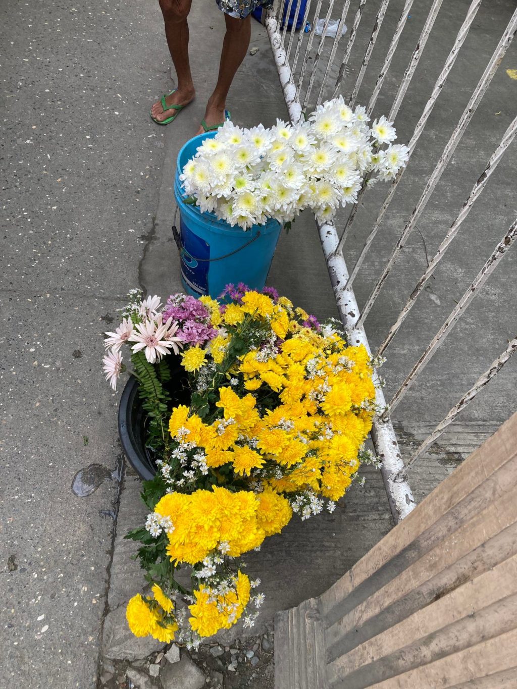 Amparo Ochia sells flowers at a spot near the San Narciso Parish Church in Consolacion town. | Jessa Ngojo
