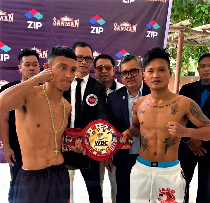 KJ Cataraja (left) and Edward Heno (right) hold the OPBF belt after passing the weigh-in for their 12-rounder bout today in General Santos City. | Michael Domingo