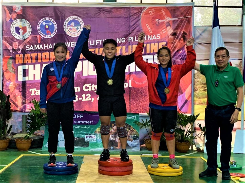 Elreen Ando (middle) together with her fellow weightlifters gets a slot in the Philippine team for the 2023 Southeast Asian Games after they won in the Samahang Weightlifting ng Pilipinas 2023 a qualifying tournament for the SEA Games. | SWP national coach Ramon Solis