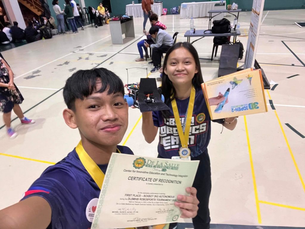 A Bogo junior high student shares her journey to winning gold in a national RoboSports tourney. In photo are Yhen Meagan Sitee and Kian Derrota, Junior high school students of City of Bogo Science and Arts Academy, who have won the gold medal for 2 kg boxbot category of the RoboSports Tournament in Cavite. | Contributed photo