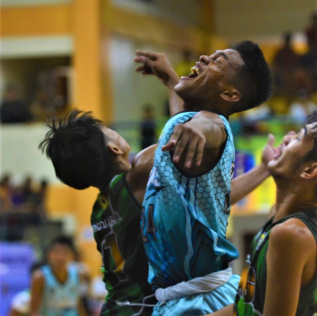 PECMNHS is OCCCI tourney's high school hoops champions. OCCCI D-League Inter-School Basketball Tournament MVP, Roniel Vasquez of the Pedro E. Candido Memorial National High School (PECMNHS), was fouled hard during their championship match against Dulag National High School in Jaro, Leyte. | Photo from the OCCCI D-League
