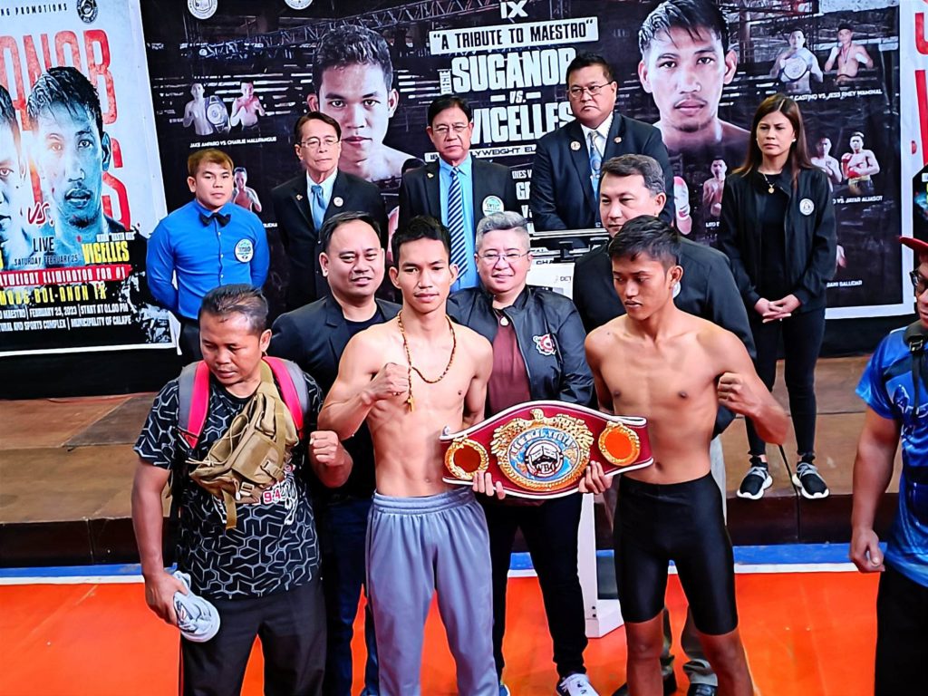 Shane Gentallan (left) and Faisol Akbar (right) holds the WBO Oriental Youth minimumweight belt after passing the weigh-in on Friday in Tagbilaran City. They are joined by PMI Boxing Promotions chief Floriezyl Podot (left, second row), PMI Colleges President Angge Brown Cloma (middle, second row), and GAB Chairman Richard Clarin (right, second row). | Glendale Rosal