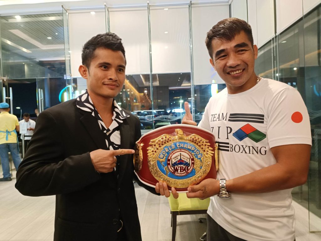 Jerusalem is GAB’s Boxer of the Month. In photo is Melvin Jerusalem (left) and his trainer Michael Domingo (right) shows the WBO world minimumweight belt. | Glendale Rosal