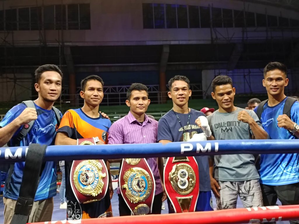Melvin Jerusalem (third from left) and Regie Suganob (third from right) were flanked by PMI Bohol Boxing Stable's boxers during Kumong Bol-Anon 9 fight card in Calape, Bohol last February 25, 2023. | Glendale Rosal