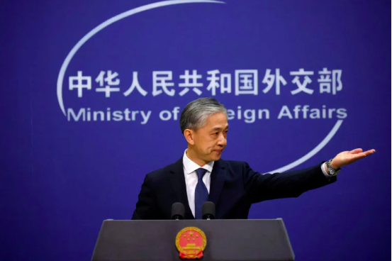 FILE PHOTO: Chinese Foreign Ministry spokesman Wang Wenbin attends a news conference in Beijing, China December 14, 2020. REUTERS/Thomas Peter