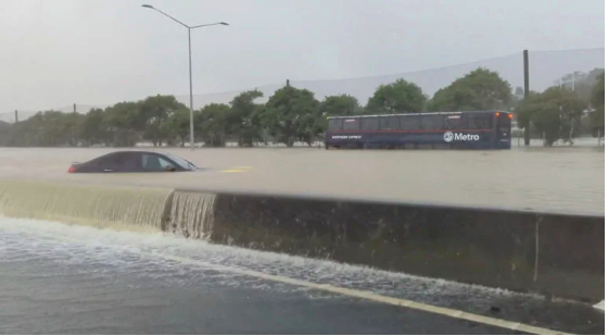 FILE PHOTO: Stranded vehicles are seen during heavy rainfall in Auckland, New Zealand January 27, 2023, in this screen grab obtained from a social media video. @MonteChristoNZ/via REUTERS