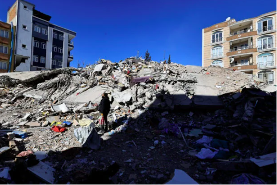 A man searches through the rubble for the remains of his belongings after his apartment was destroyed in the aftermath of a deadly earthquake in Adiyaman, Turkey February 16, 2023. (REUTERS)