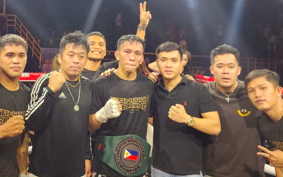 Presco Carcosia with the PBF belt around his waist celebrates with his managers from Sanman Boxing Team after beating Arnel Baconaje last Sunday evening in General Santos City. | Photo from Sanman Boxing's Facebook page