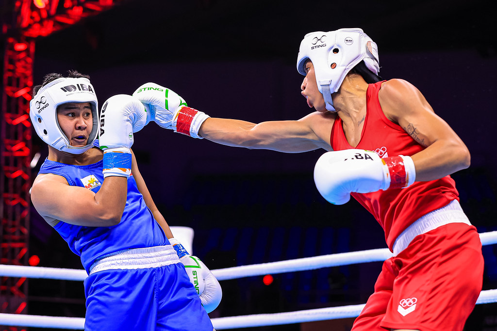 Nesthy Petecio tries to avoid a jab from Venezuelan Omailyn Alcala in their IBA Women's World Boxing Championships bout in New Delhi, India on March 21.