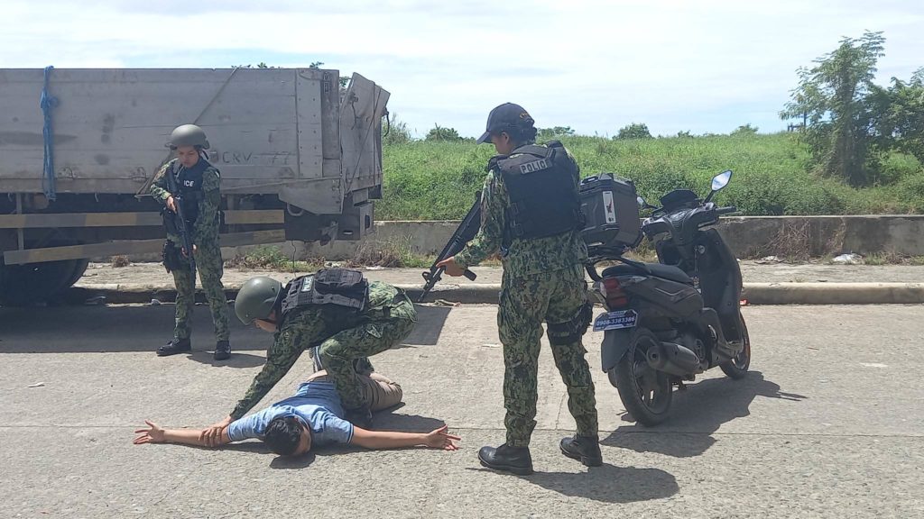Policewomen of the Mandaue City Police Office apply what they learned as they show how to arrest a suspect during their training with Special Weapons and Tactics personnel. | Mary Rose Sagarino 