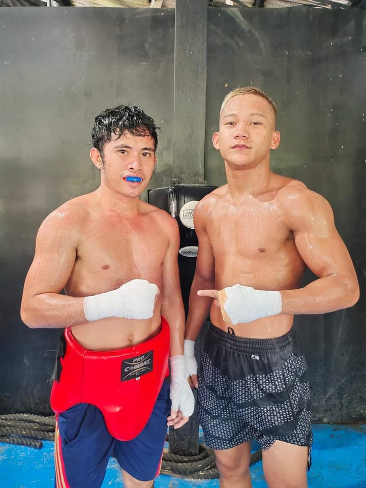 Gabunilas handling pressure well as fight against Indonesian boxer draws near. Johnpaul Gabunilas (right) poses with WBO world minimumweight champion Melvin Jerusalem (left) after finishing one of their sparring sessions earlier this year in Cebu. | Photo from ARQ Sports