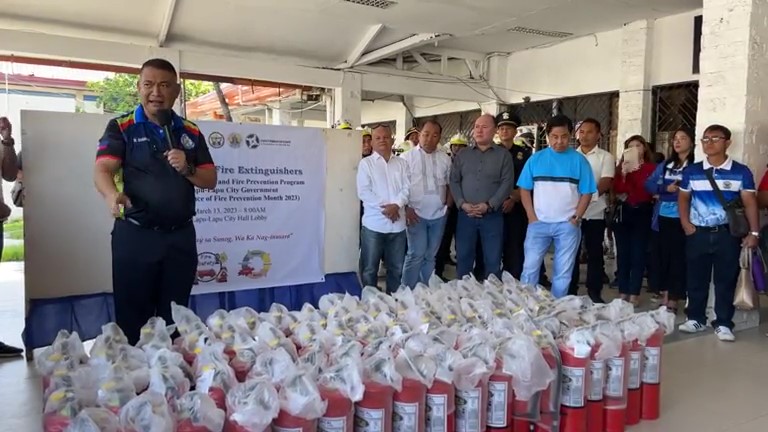 Lapu-Lapu City Mayor Junard Chan leads the distribution of fire extinguishers to 50 urban poor groups today, March 13. | Futch Anthony Inso