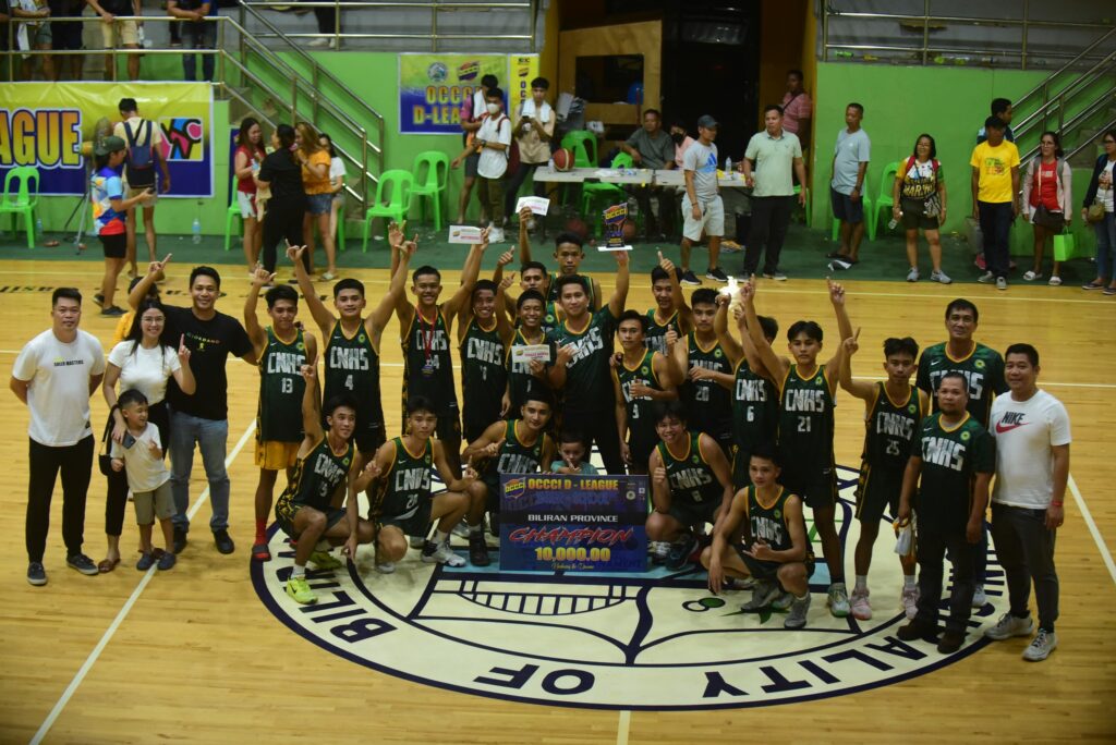 The Calubian National High School (CNHS) team wins the division title of the Biliran Province leg of the OCCCI D-League Interschool Basketball Tournament in a winner-take all match against Cabucgayan National School of Arts and Trades on Sunday, March 19. In photo the team and OCCCI D-League officials pose for a group photo during the awarding ceremony. Contributed photo