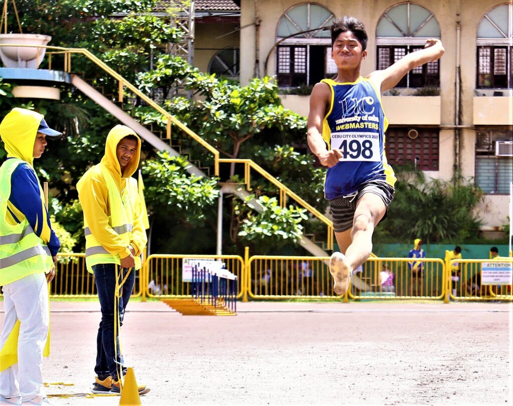 30th Cebu City Olympics: UC harvests gold medals, breaks records in athletics and swimming events. In photo is Anthony James Salem of UC, who leaps high in the secondary boys' long jump event of the 30th Cebu City Olympics at the CCSC on Sunday. | Photo from Sugbuanong Kodaker