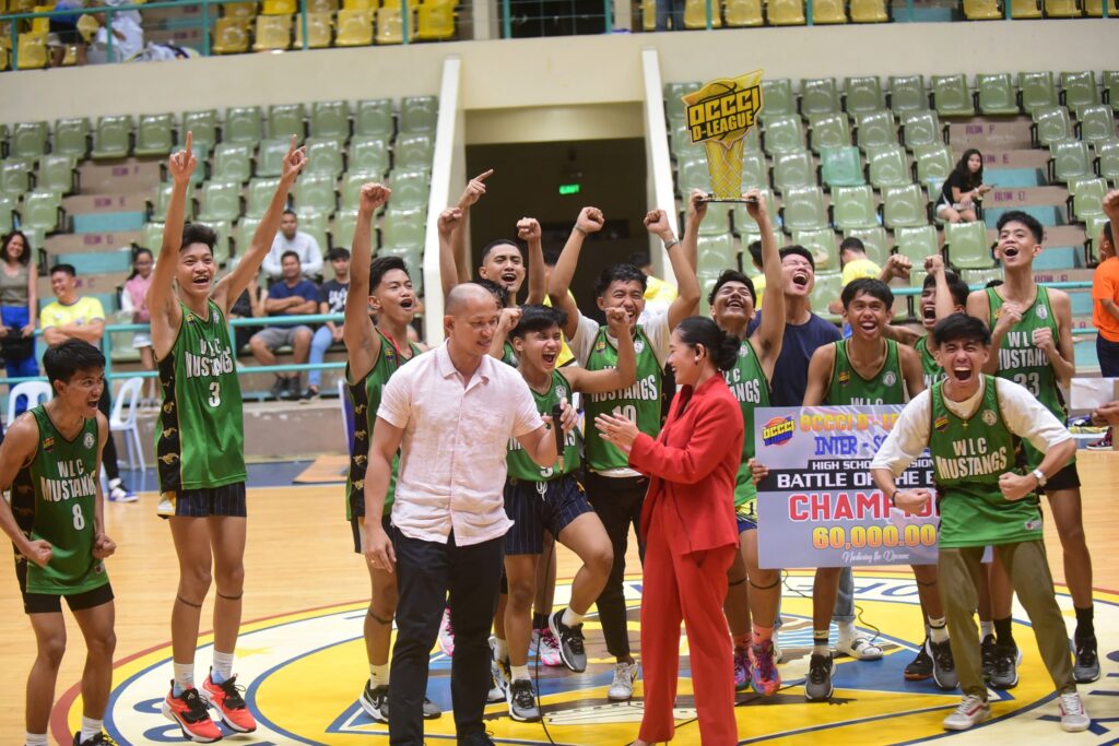  The Western Leyte College (WLC) of Ormoc Mustangs players celebrate as they receive their prize in the OCCCI D-League Interschool Basketball Tournament : Battle of the Best. | Photo from OCCCI D-League 