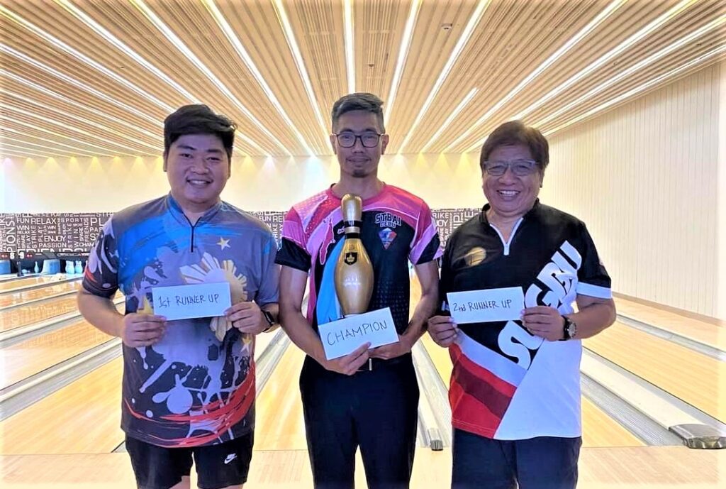 Luke Bolongan (center) is flanked by second placer Aui padawan (left) and Noli Valencia (right) during the awarding ceremony of the SUGBU Bowler of the Month tilt. | Contributed Photo