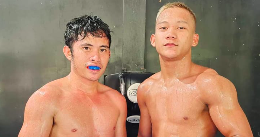 Johnpaul Gabunilas (right) poses with WBO world minimumweight champion Melvin Jerusalem (left) after finishing one of their sparring sessions earlier this year in Cebu. | Photo from ARQ Sports