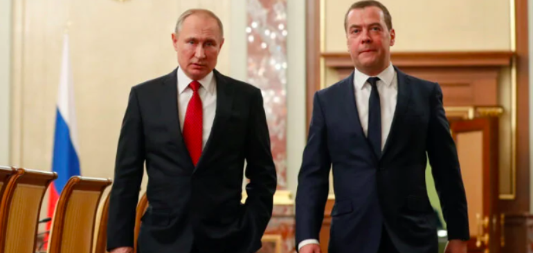 Russian President Vladimir Putin and Prime Minister Dmitry Medvedev speak before a meeting with members of the government in Moscow, Russia January 15, 2020. Sputnik/Dmitry Astakhov/Pool via REUTERS
