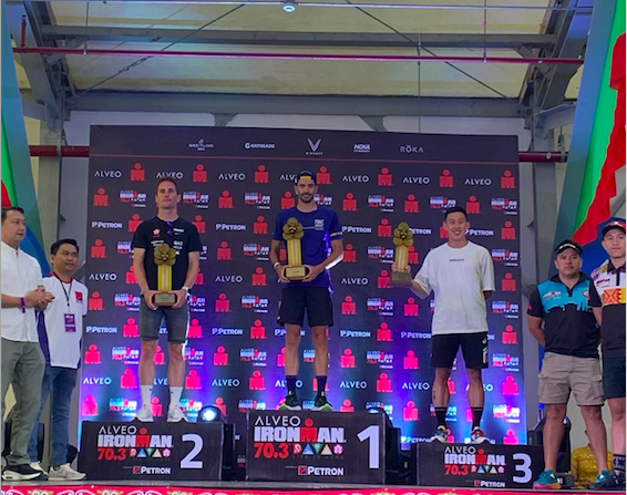 Felipe Azevedo of Portugal (center) receives his trophy for winning the Alveo Ironman 70.3 Davao (pro category) on March 26. | Photo from the Alveo Ironman 70.3 Davao
