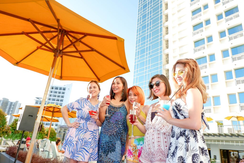 Ladies enjoying their summer drink behind at Quest Hotel & Conferences Cebu 